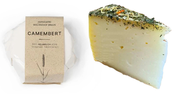 KI generiert: Verpackter Camembert und geöffneter Kräuterkäse von der Hofkäserei Biolandhof Braun.
